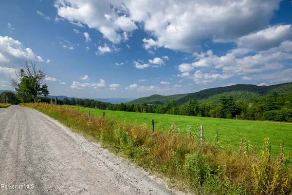 a view of a lake with a big yard