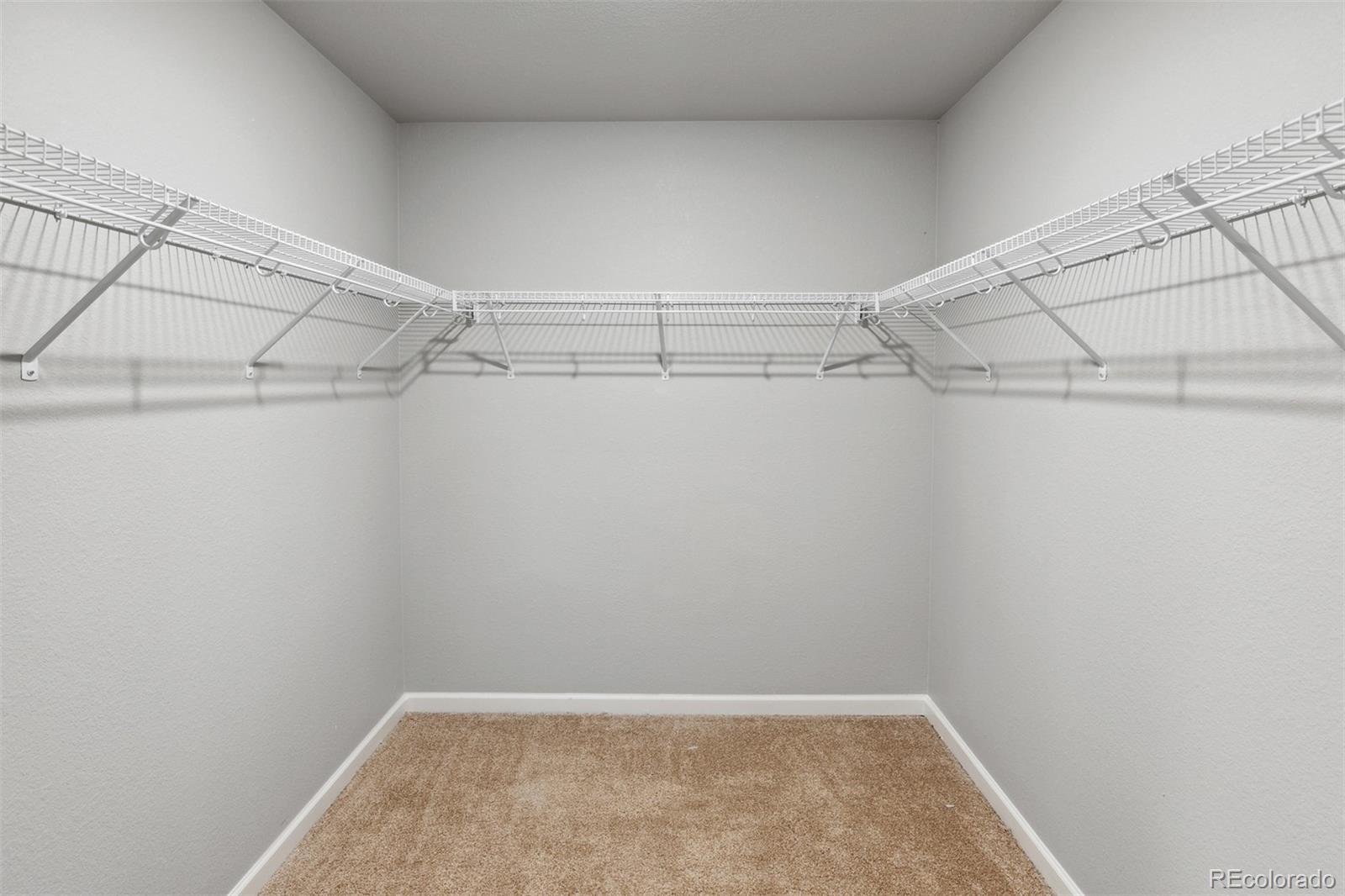 2160 Christina Street Fort Lupton, CO 80621 - Photo 14 of 41 a view of a room with racks on the wall