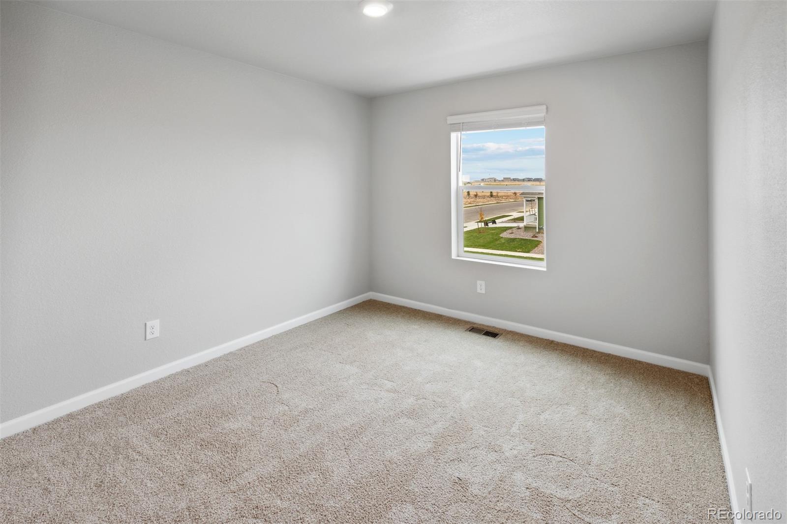 2160 Christina Street Fort Lupton, CO 80621 - Photo 17 of 41 an empty room with a window