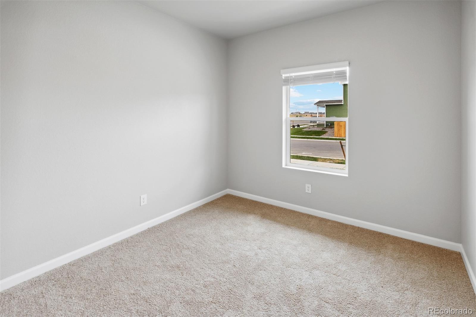 2160 Christina Street Fort Lupton, CO 80621 - Photo 9 of 41 an empty room with a window