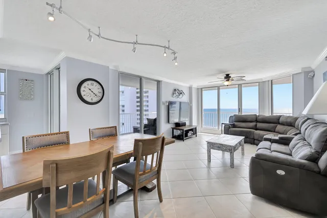 a kitchen with stainless steel appliances granite countertop a sink a refrigerator and a stove