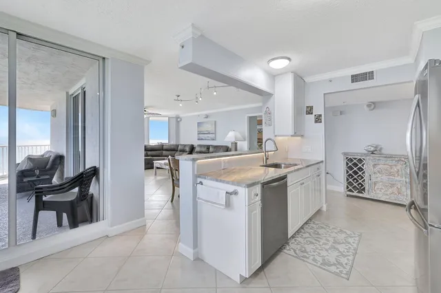 a bathroom with a granite countertop bathtub sink and mirror