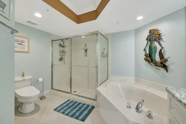 a bedroom with a bed couch and window