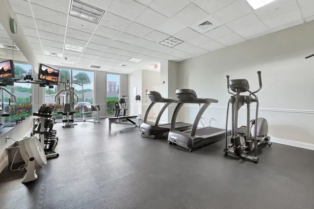 a view of a dining room kitchen with furniture and a large window
