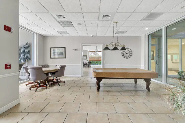 a aerial view of a house with a yard and potted plants
