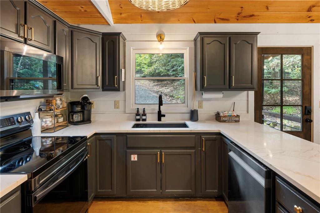 120 Brookhaven Trail Blue Ridge, GA 30513 - Photo 16 of 100 a kitchen with a sink and large window