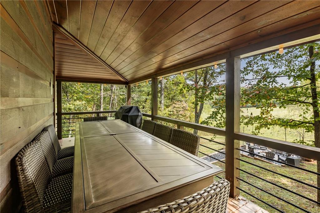 120 Brookhaven Trail Blue Ridge, GA 30513 - Photo 31 of 100 a view of a balcony with floor to ceiling windows with wooden floor