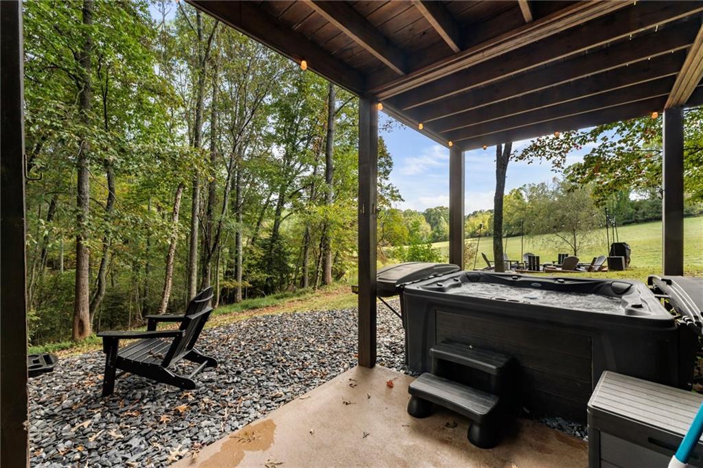 120 Brookhaven Trail Blue Ridge, GA 30513 - Photo 71 of 100 a view of a patio with table and chairs and wooden floor