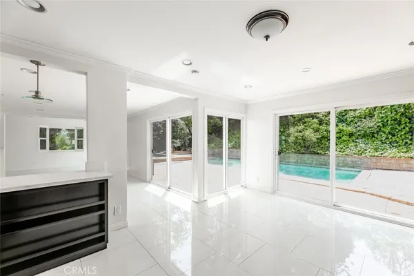 a view of a room with window and hardwood floor