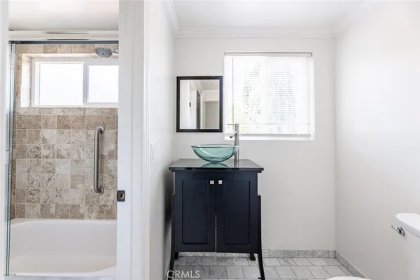 a bathroom with a sink a mirror and a bathtub
