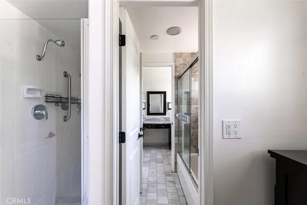 a view of a bathroom from a hallway