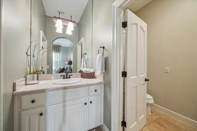a bathroom with a double vanity sink and mirror