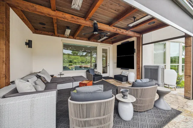 a view of house with swimming pool and porch