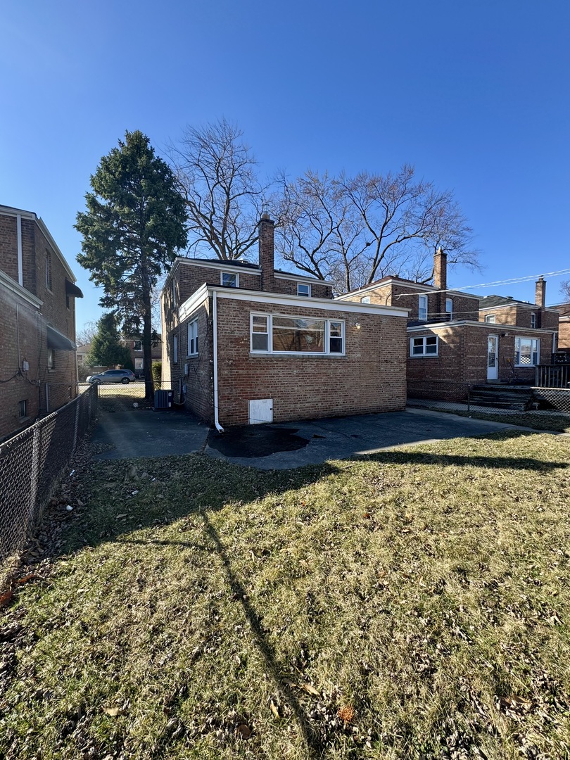 3338 West 83rd Place Chicago, IL 60652 - Photo 24 of 26 a view of a house with a yard
