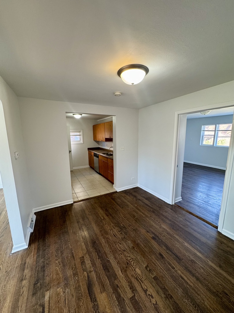 3338 West 83rd Place Chicago, IL 60652 - Photo 6 of 26 a view of empty room with wooden floor