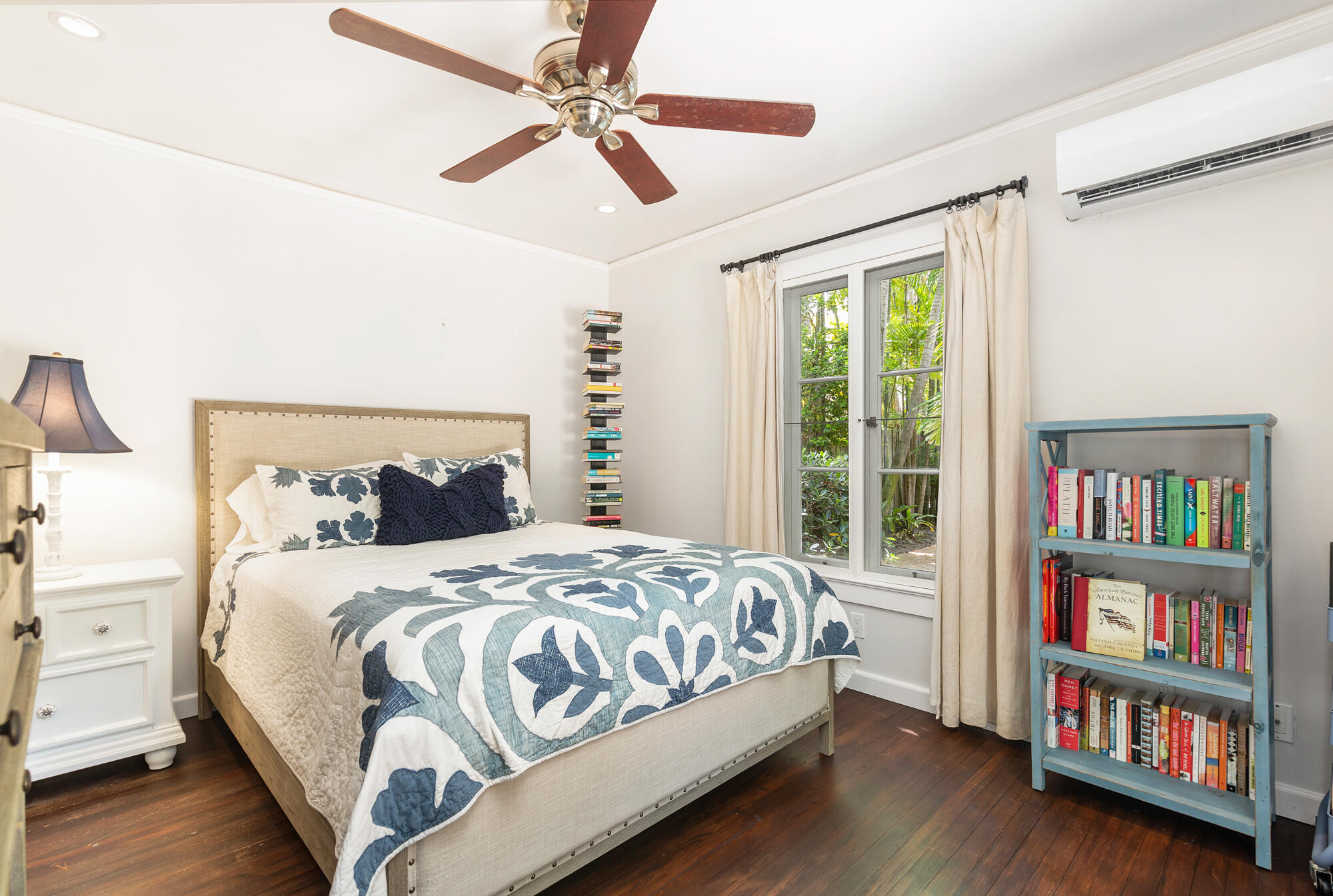 205 Westminster Road West Palm Beach, FL 33405 - Photo 19 of 37 a bedroom with a bed a book shelf and a window