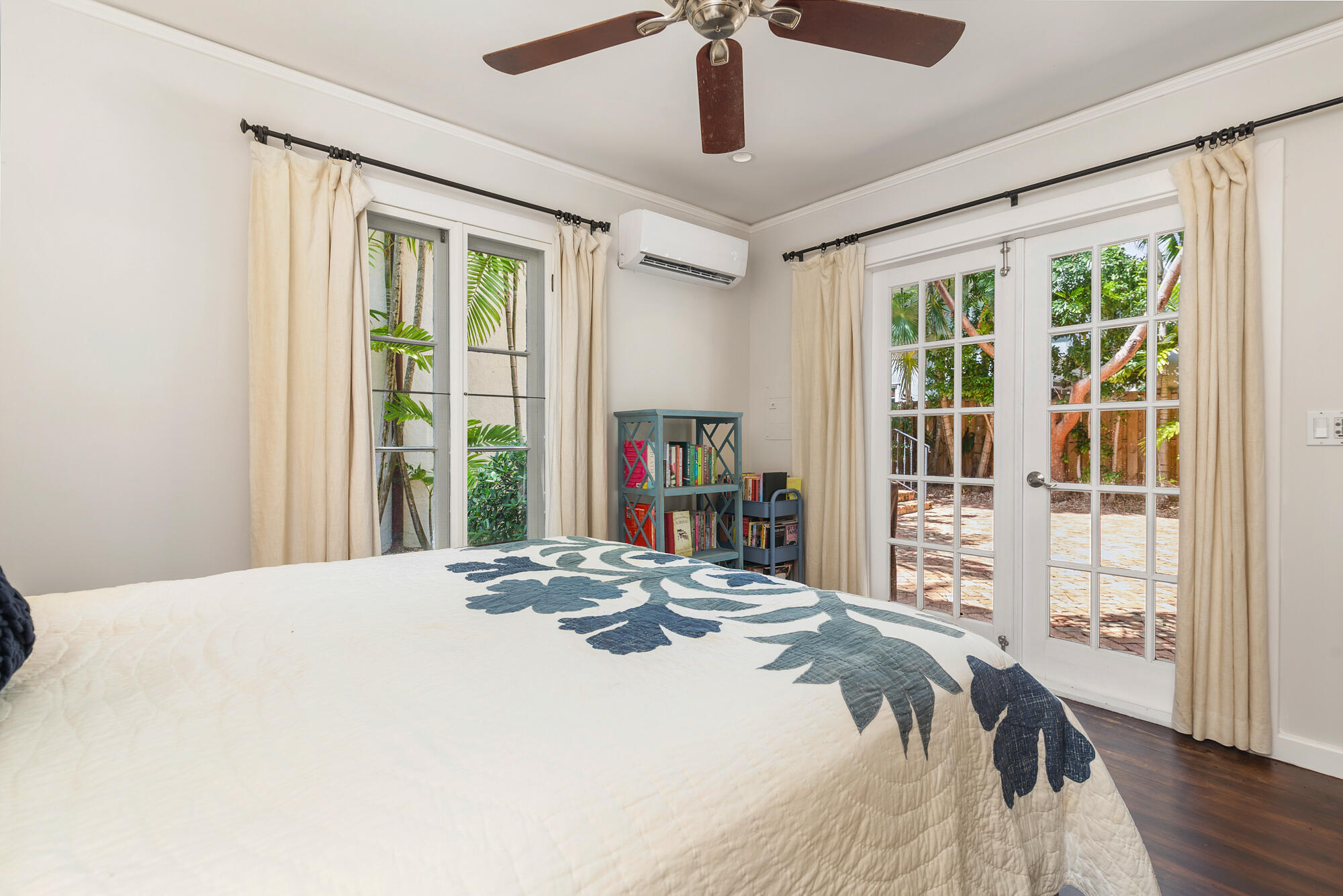 205 Westminster Road West Palm Beach, FL 33405 - Photo 20 of 37 a bedroom with a large bed and a large window