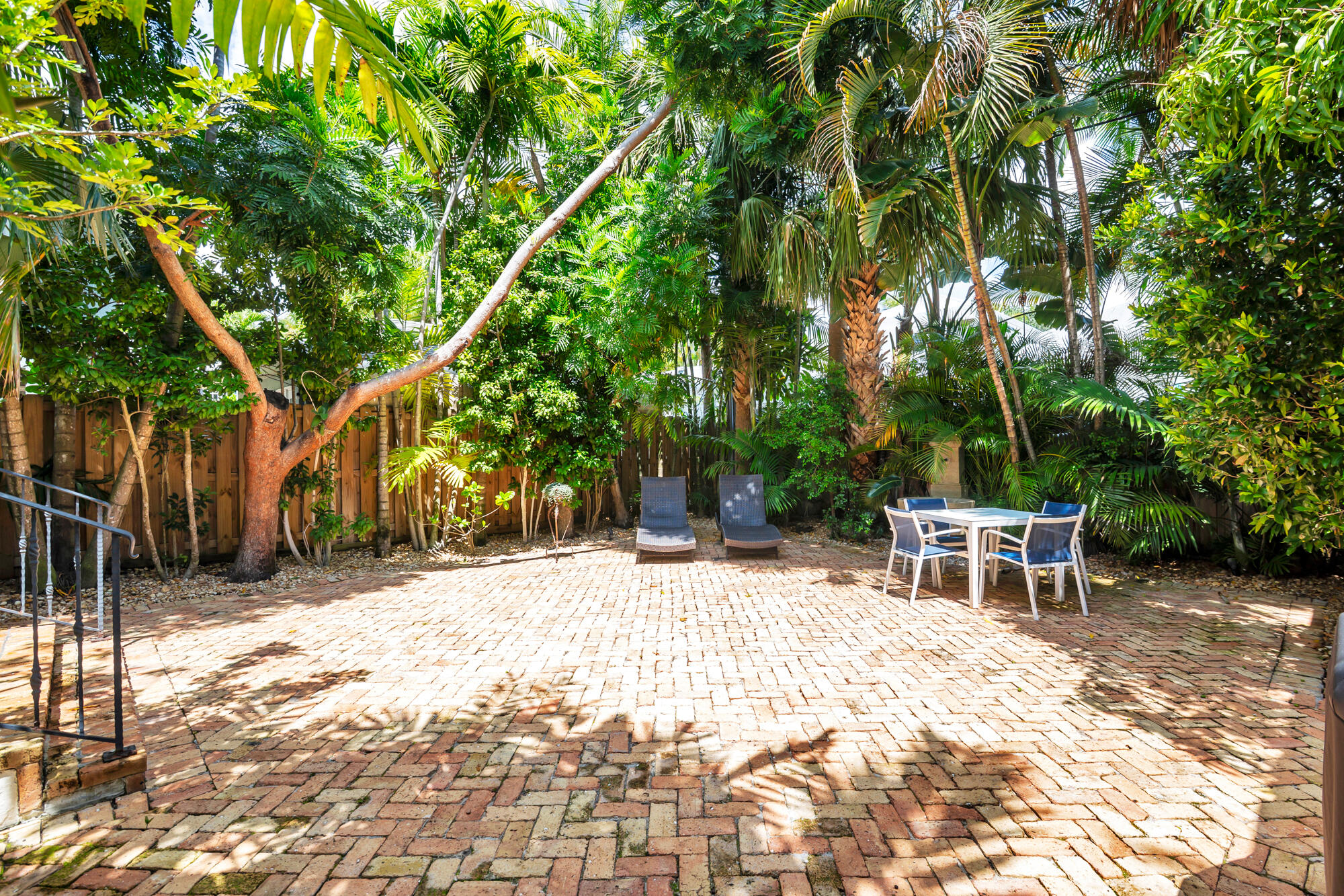 205 Westminster Road West Palm Beach, FL 33405 - Photo 24 of 37 a wooden bench sitting in middle of a yard