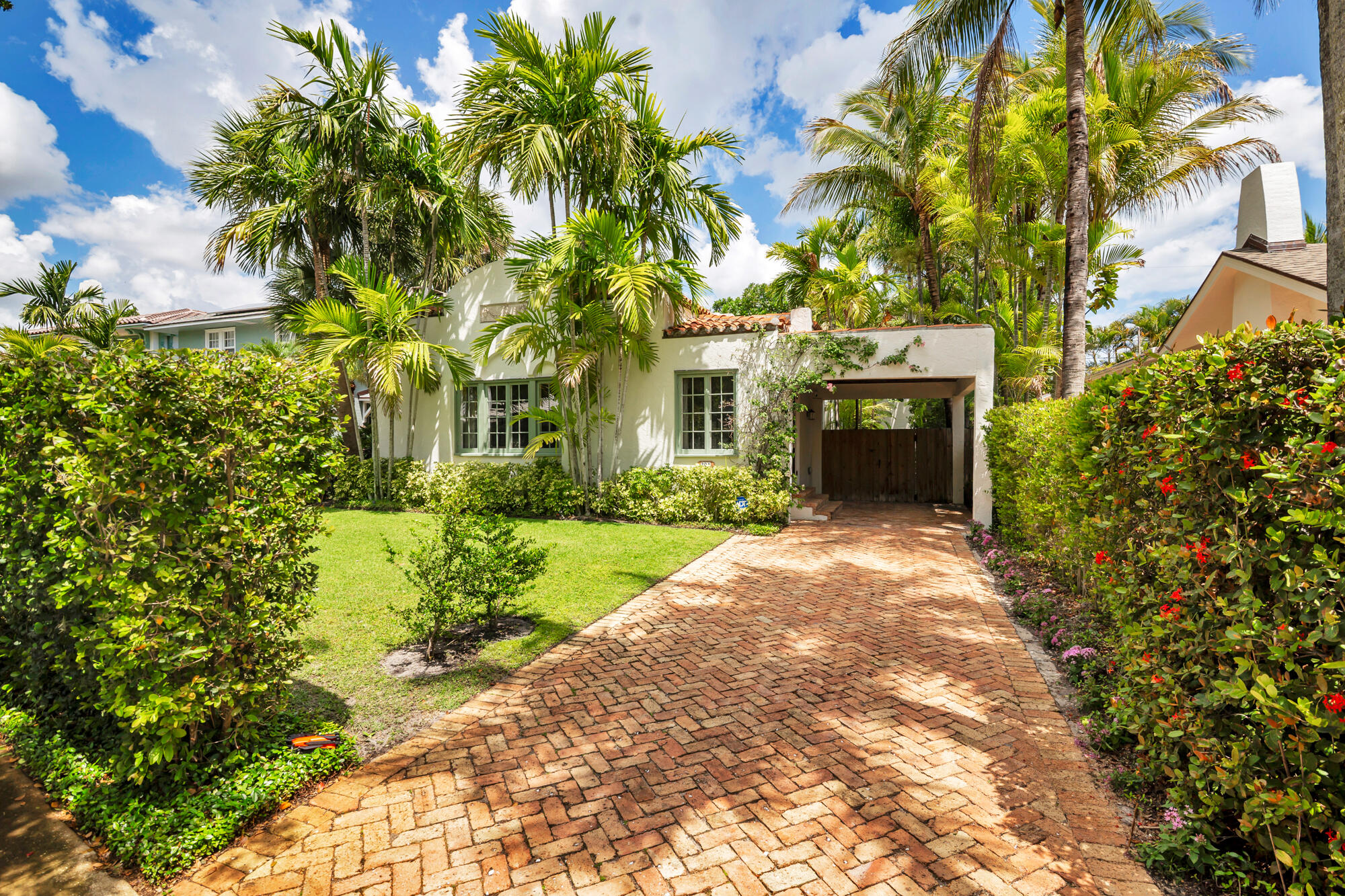 205 Westminster Road West Palm Beach, FL 33405 - Photo 30 of 37 a front view of a house with a yard and garage