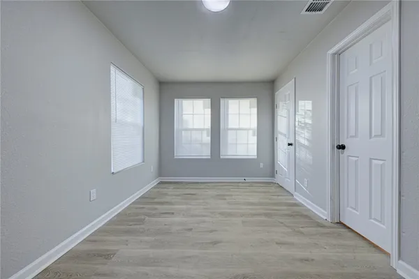a view of an empty room with a window