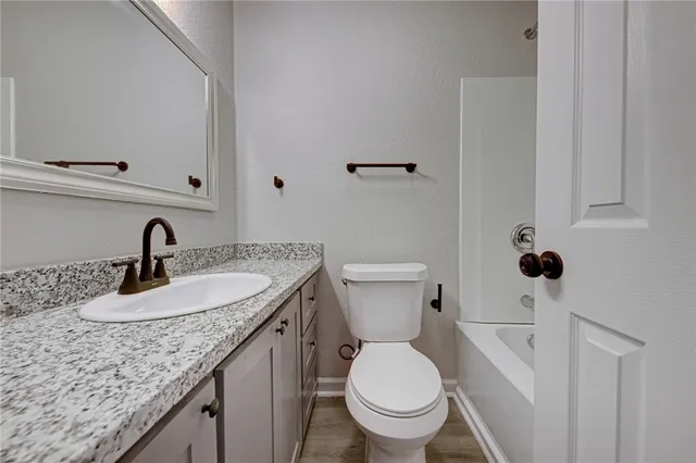 a bathroom with a sink and a toilet