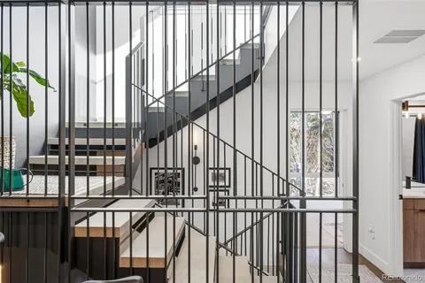 a view of staircase with railing and a floor to ceiling window