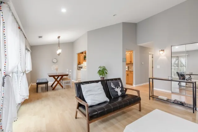 a living room with furniture and a table