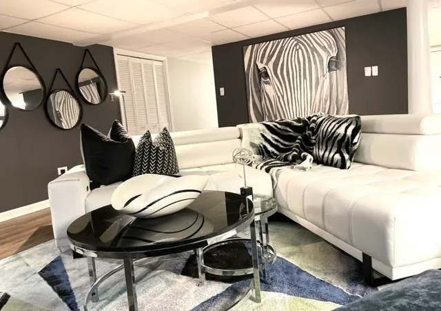 a kitchen with stainless steel appliances granite countertop a sink stove and cabinets