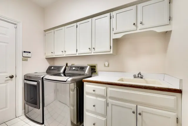 a living room with a couch and a rug