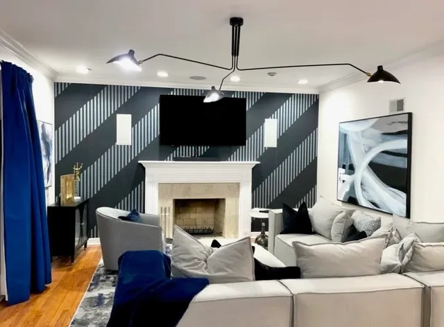 a living room with furniture and a fireplace