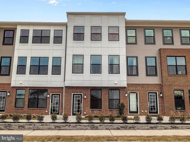 a front view of a building with a lots of windows