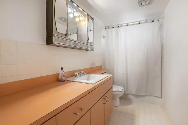 a view of kitchen with furniture and wooden floor
