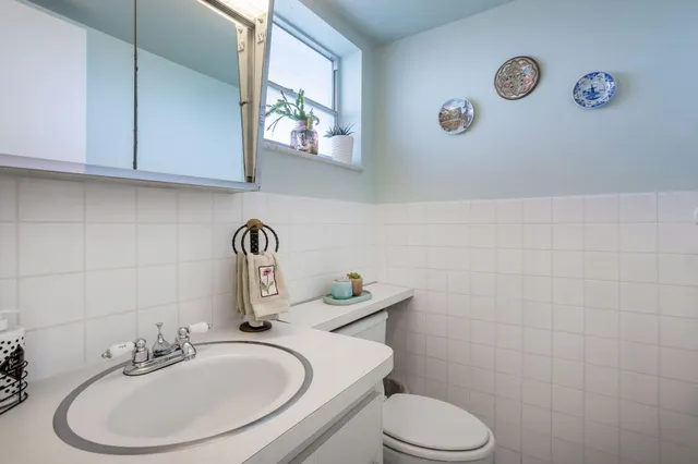 a view of a big room with windows and closet