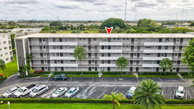 a view of a building and yard with green space