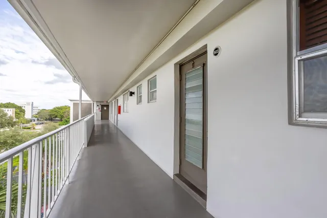 a view of a balcony with wooden floor