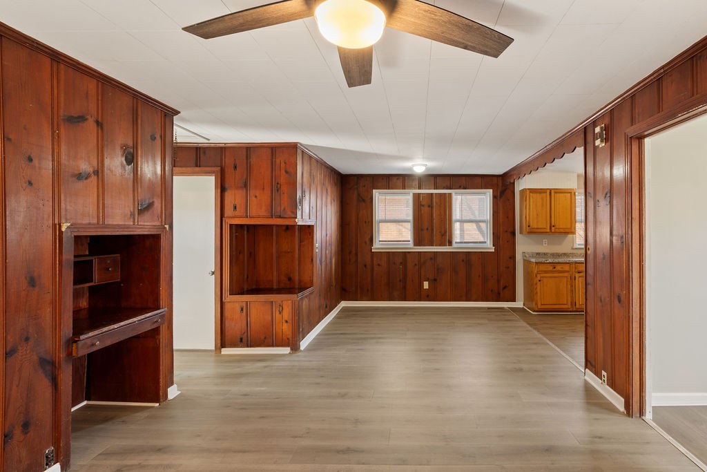 551 Magazine Road Pulaski, TN 38478 - Photo 13 of 25 a view of an empty room with wooden floor and a window