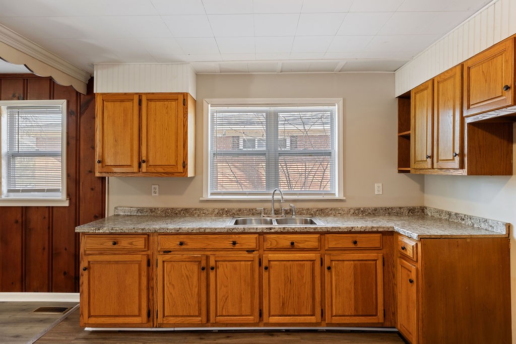 551 Magazine Road Pulaski, TN 38478 - Photo 15 of 25 a kitchen with granite countertop cabinets sink and window