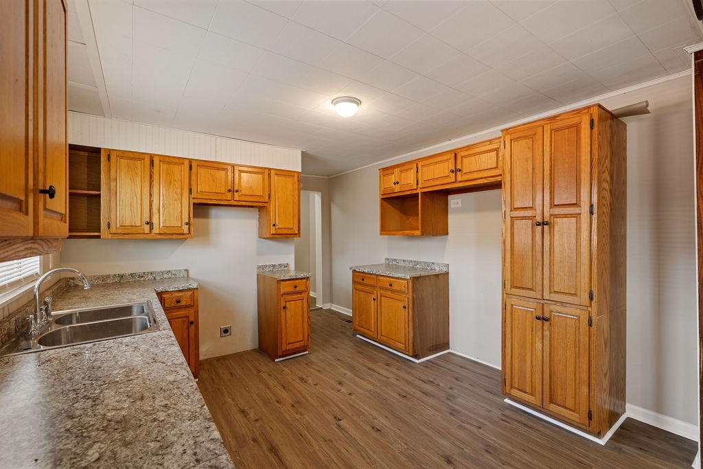 551 Magazine Road Pulaski, TN 38478 - Photo 16 of 25 a view of a livingroom with wooden floor and a refrigerator