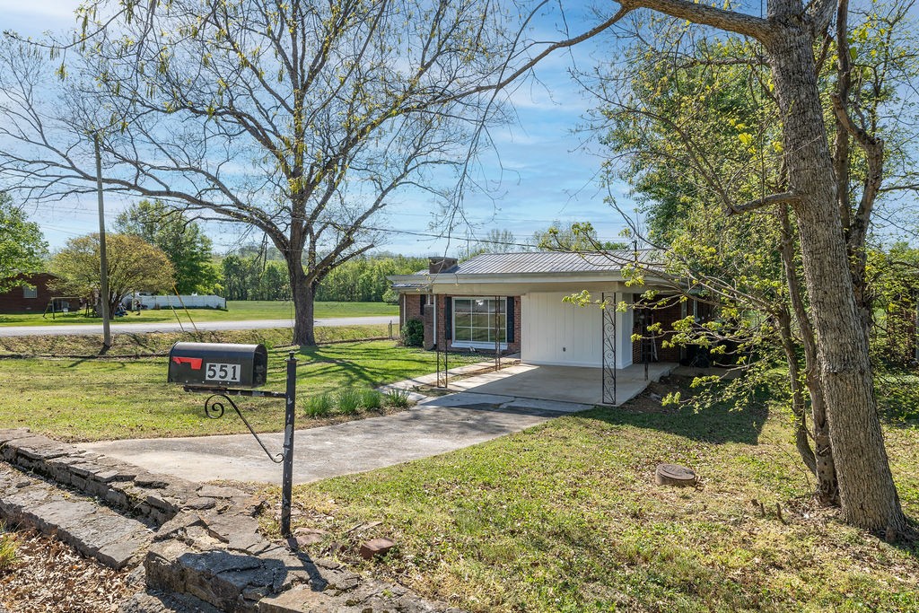 551 Magazine Road Pulaski, TN 38478 - Photo 2 of 25 a view of a house with backyard and a tree