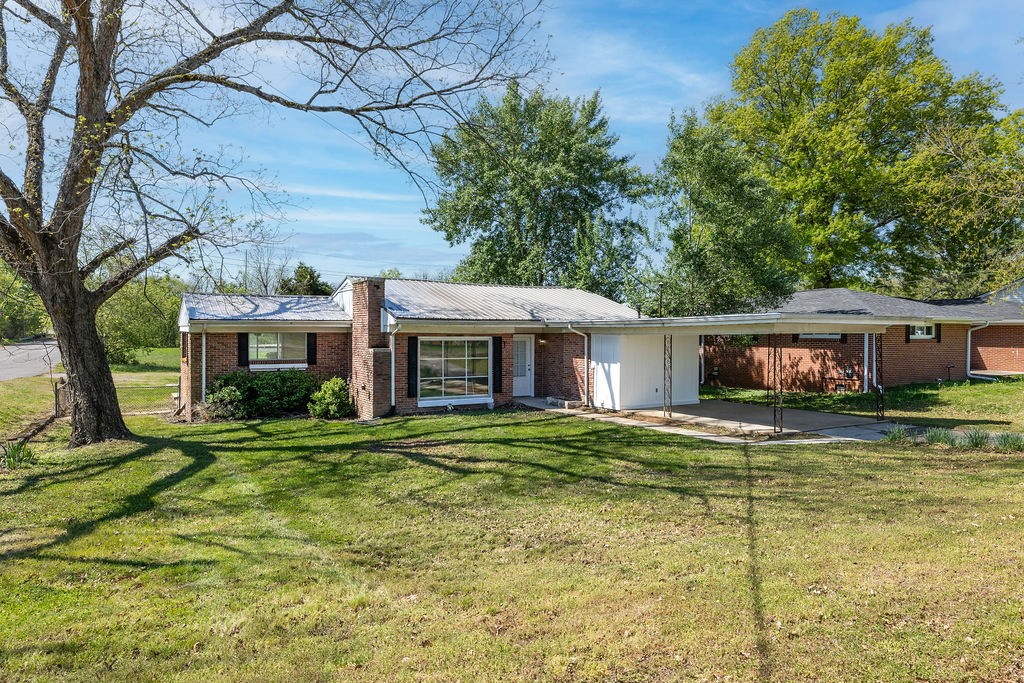 551 Magazine Road Pulaski, TN 38478 - Photo 4 of 25 a view of a yard in front of a house with large tree