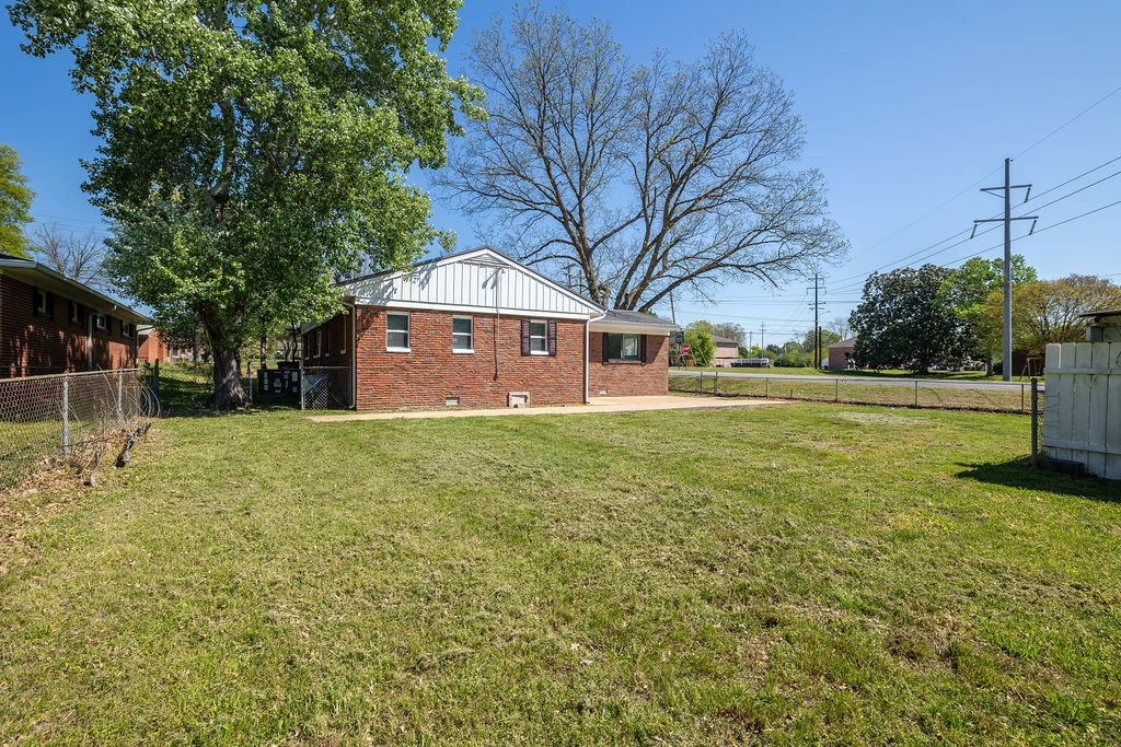 551 Magazine Road Pulaski, TN 38478 - Photo 5 of 25 a front view of a house with a yard
