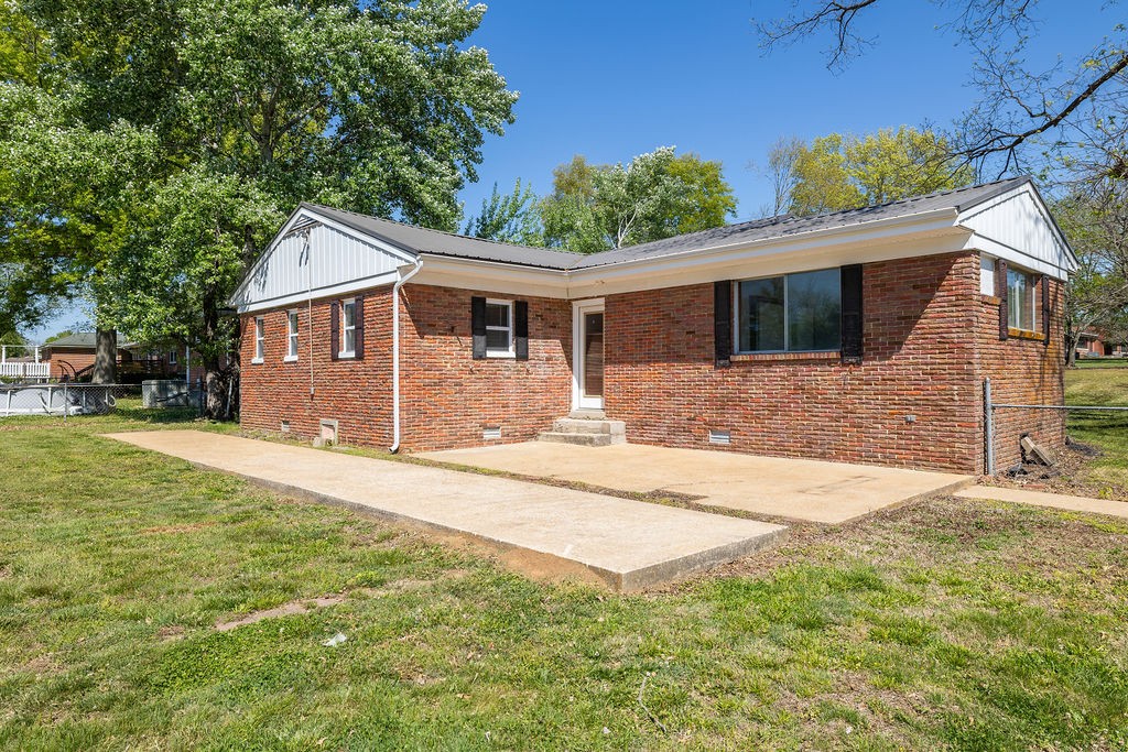 551 Magazine Road Pulaski, TN 38478 - Photo 6 of 25 a front view of house with yard and trees in the background