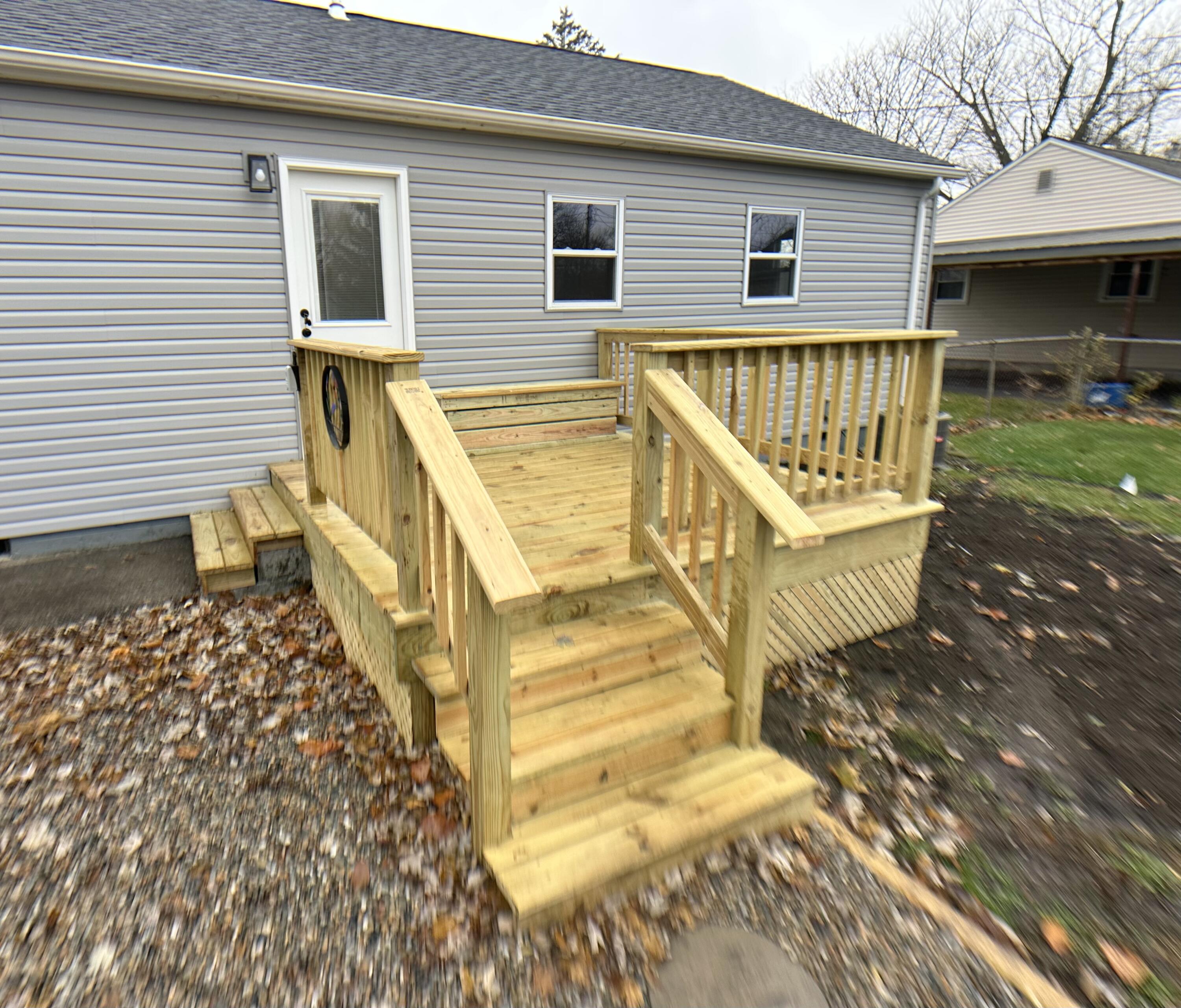 306 Maple Street Crown Point, IN 46307 - Photo 14 of 21 a view of a house with a wooden deck