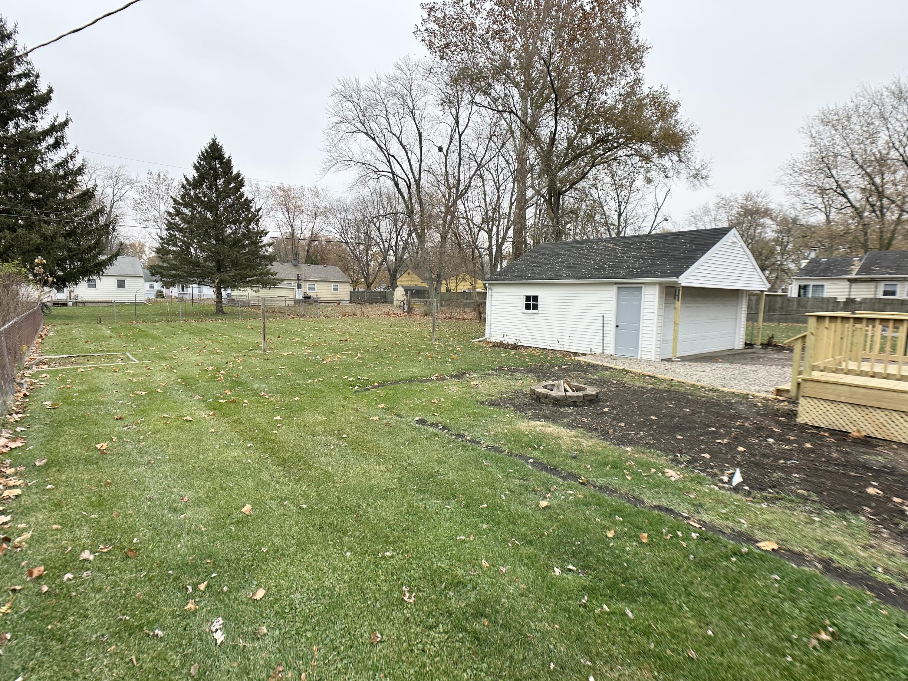 306 Maple Street Crown Point, IN 46307 - Photo 16 of 21 a view of a house with a yard
