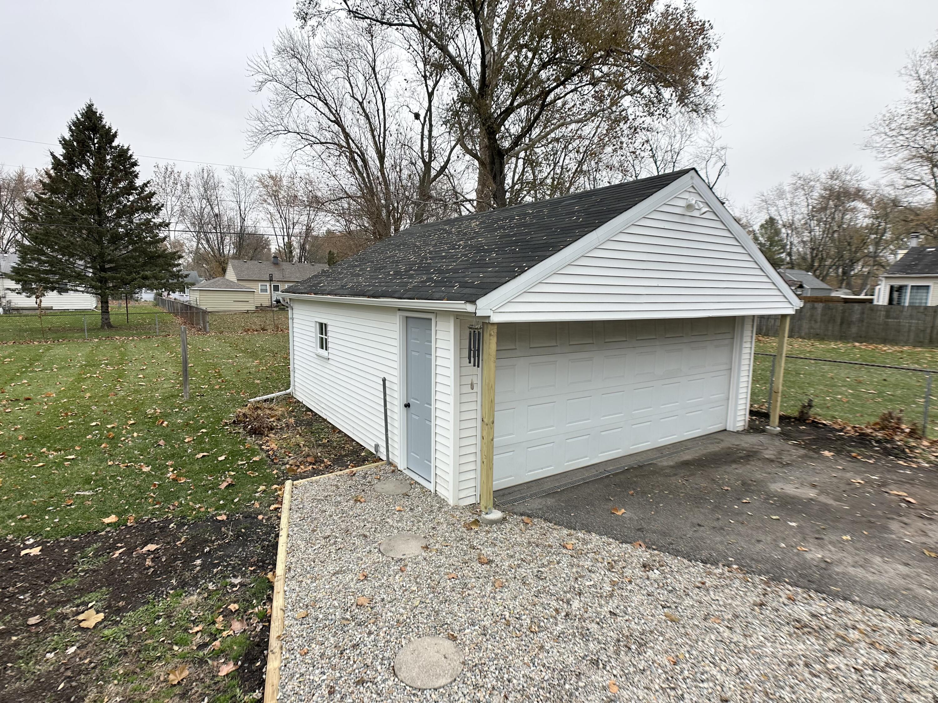 306 Maple Street Crown Point, IN 46307 - Photo 17 of 21 a front view of a house with garden