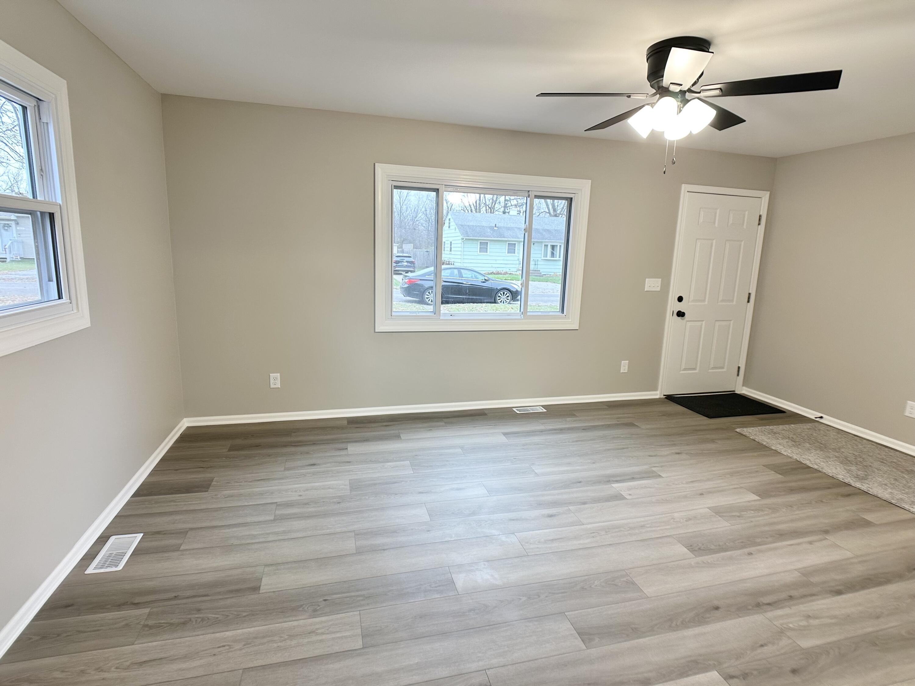 306 Maple Street Crown Point, IN 46307 - Photo 5 of 21 a view of room window and wooden floor