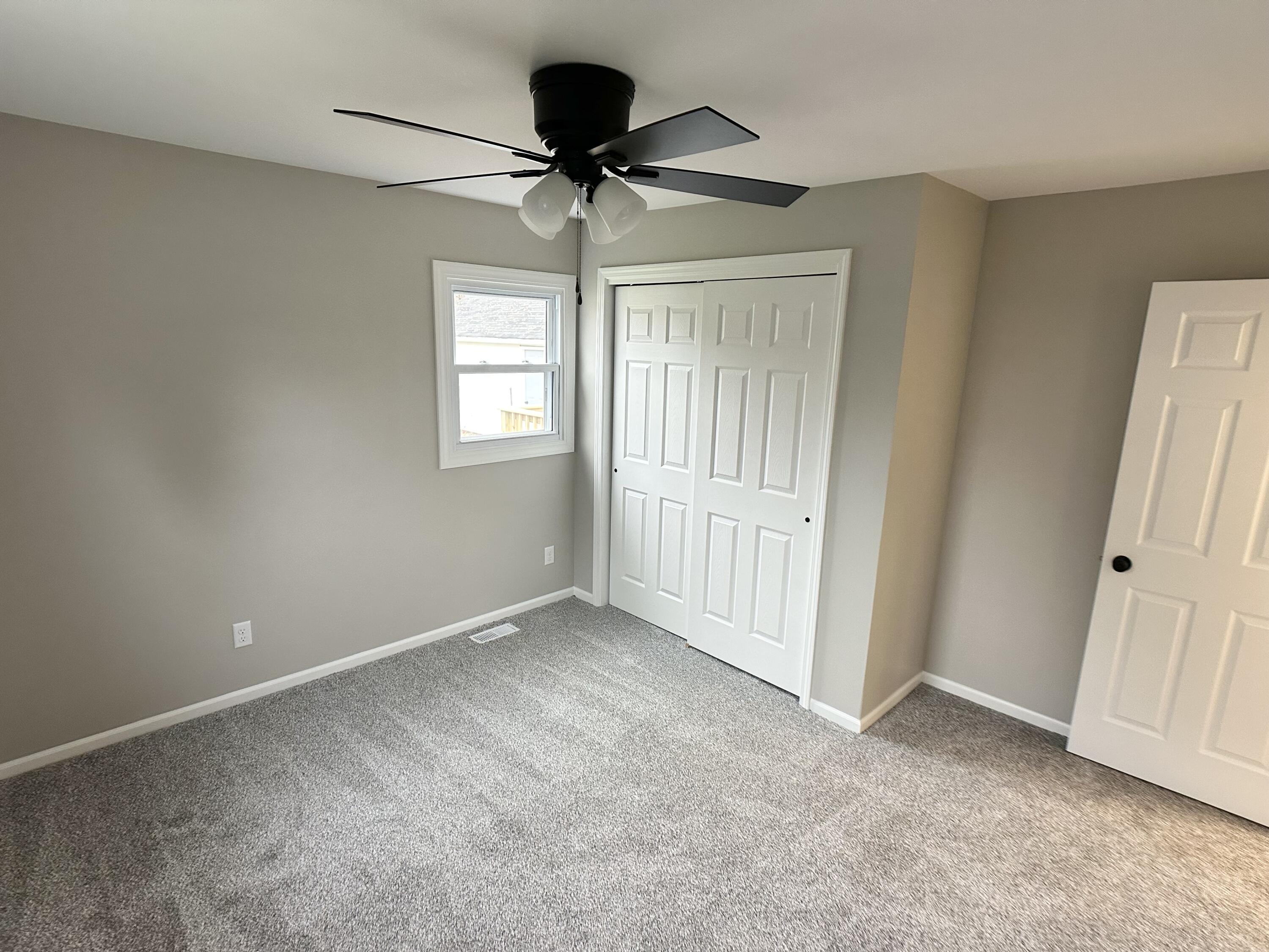 306 Maple Street Crown Point, IN 46307 - Photo 8 of 21 a view of an empty room with a window