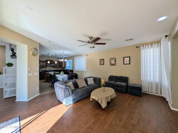 a bedroom with a bed and a ceiling fan