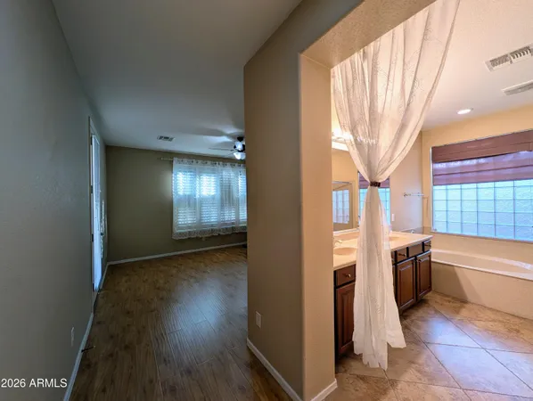 a view of a storage and utility room with washer and dryer