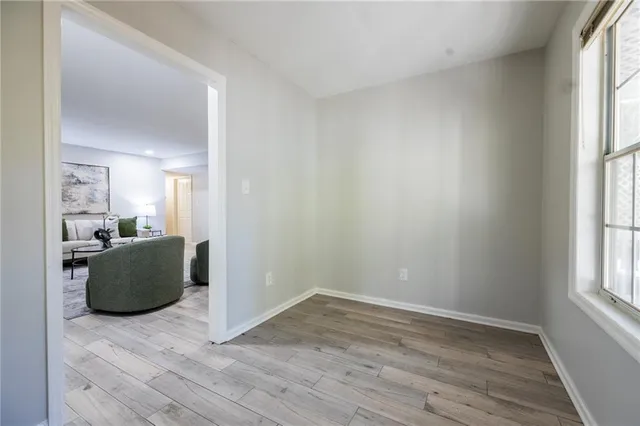a view of kitchen with furniture and wooden floor